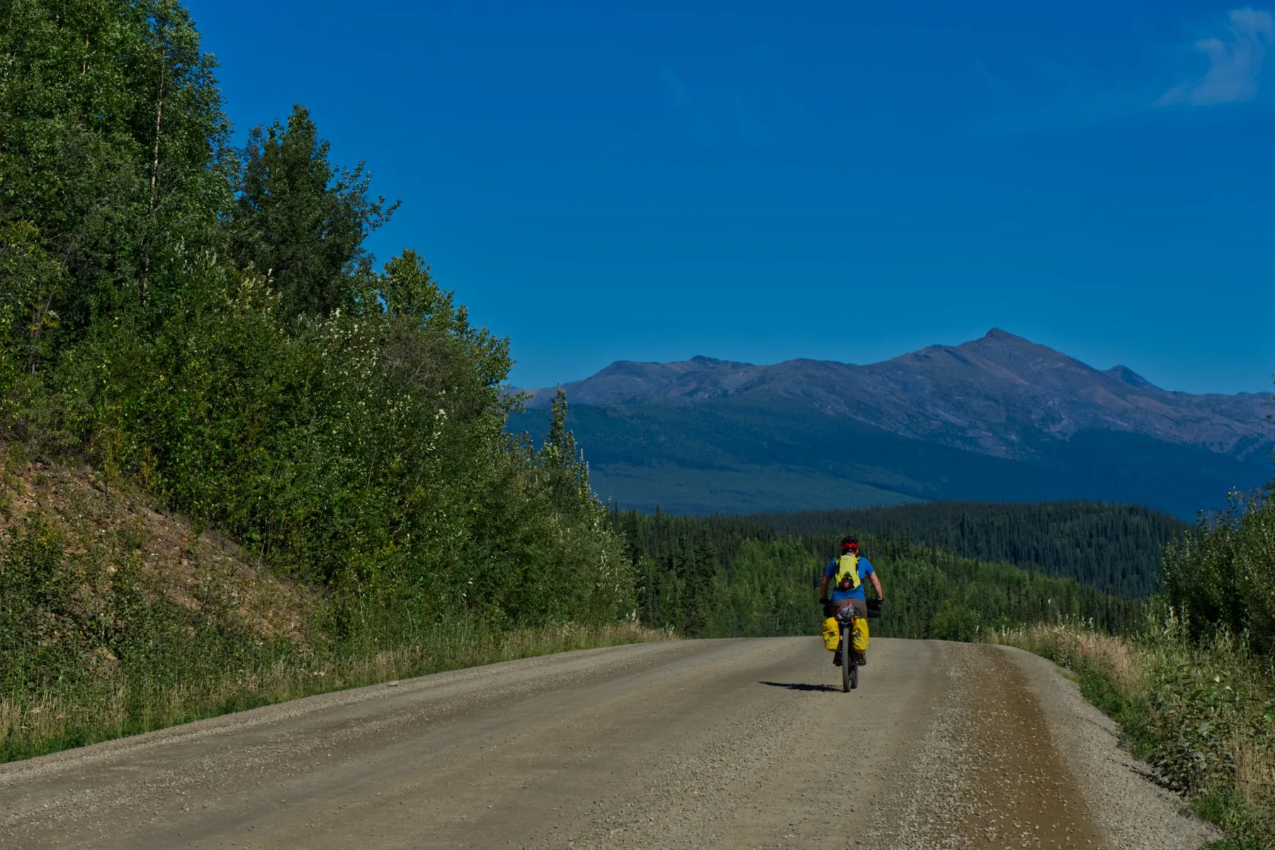 Rider on a remote Alberta gravel road
